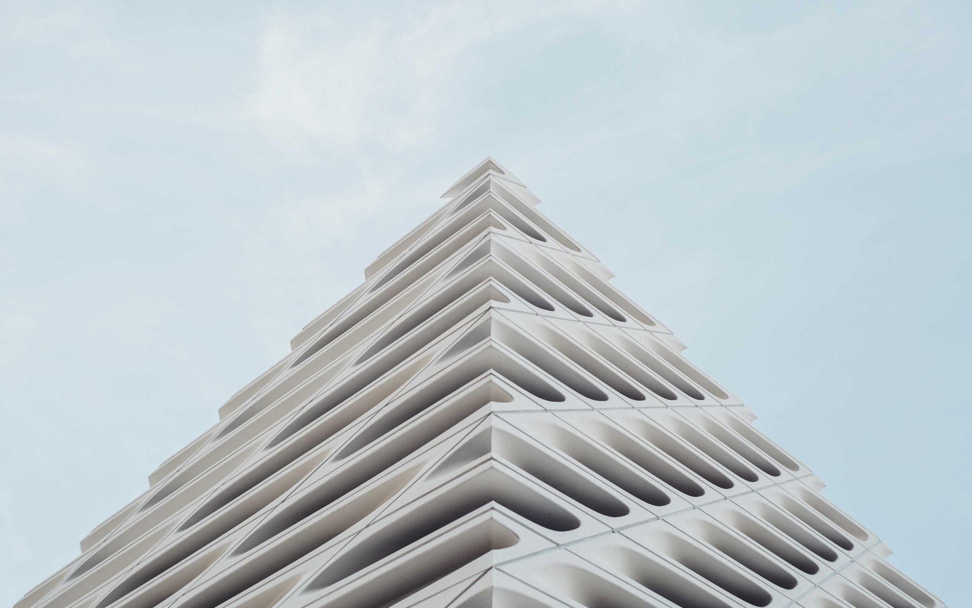 Stepped modernist building against a clear sky